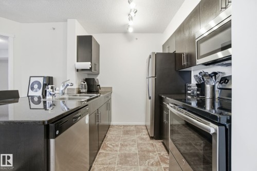 420 3315 James Mowatt Trail, Edmonton, AB - Indoor Photo Showing Kitchen With Double Sink