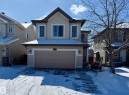 The property features an attached garage with a paved driveway - 1609 Hodgson Crest, Edmonton, AB  - Outdoor With Facade 