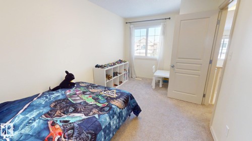 This room features light-colored walls and carpeted flooring - 1609 Hodgson Crest, Edmonton, AB - Indoor Photo Showing Bedroom