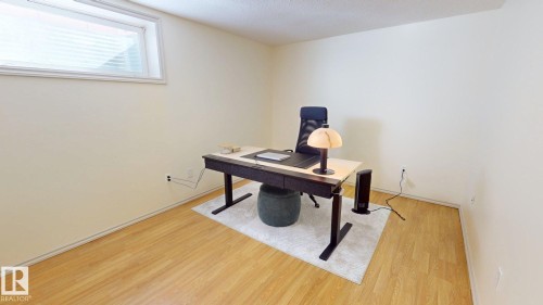 This room features light-toned flooring and a window with blinds - 1609 Hodgson Crest, Edmonton, AB - Indoor Photo Showing Office