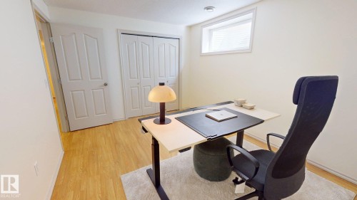 This room features light-toned flooring, white walls, and a window with blinds - 1609 Hodgson Crest, Edmonton, AB - Indoor Photo Showing Office