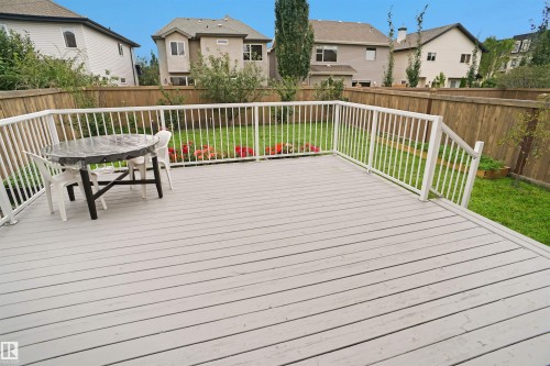 The property features a spacious deck with white railings and a view of the lawn area - 1609 Hodgson Crest, Edmonton, AB - Outdoor With Deck Patio Veranda With Exterior