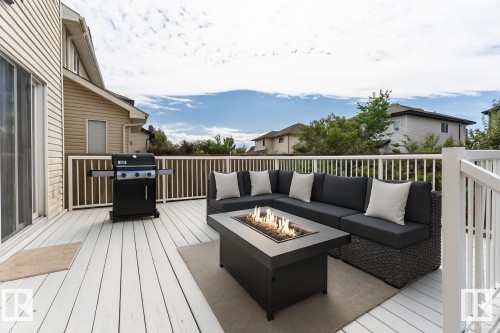 This property features a spacious outdoor deck with white railings, offering ample room for entertaining - 1609 Hodgson Crest, Edmonton, AB - Outdoor With Deck Patio Veranda With Exterior