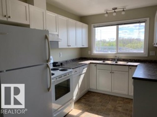 8317 69 Avenue, Edmonton, AB - Indoor Photo Showing Kitchen With Double Sink