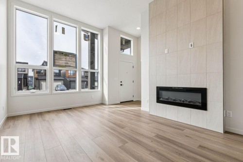 319 30 Street, Edmonton, AB - Indoor Photo Showing Living Room With Fireplace