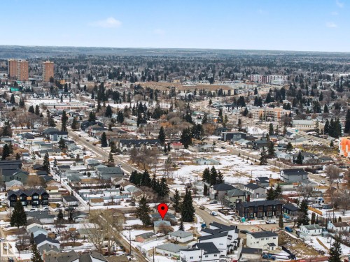 Aerial view of the property's surroundings, featuring a residential neighborhood with various homes and mature trees - 9409 154 Street, Edmonton, AB - Outdoor With View