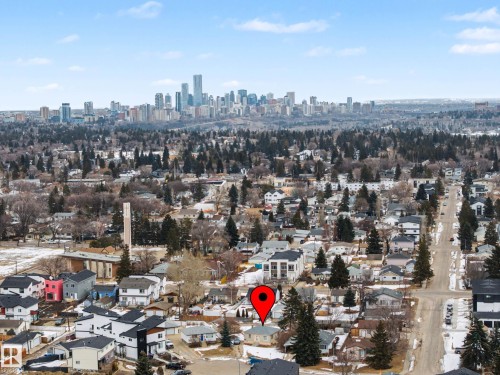 Aerial view of the property and surrounding neighborhood, featuring distant city skyline views - 9409 154 Street, Edmonton, AB - Outdoor With View