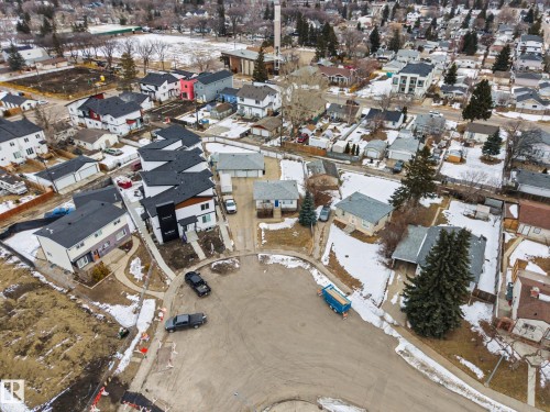 Aerial view showcasing the property within a residential neighborhood featuring diverse architectural styles and mature trees - 9409 154 Street, Edmonton, AB - Outdoor With View