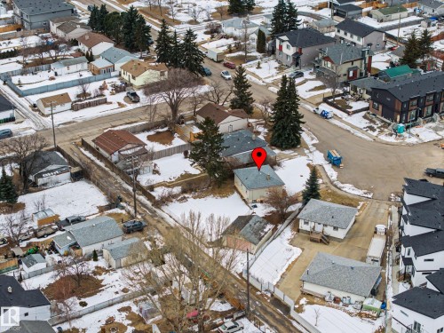 Aerial view of the property and its surrounding neighbourhood, featuring paved streets and a mix of detached and attached residences - 9409 154 Street, Edmonton, AB - Outdoor With View