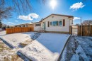 The property features a white exterior with brown window shutters, a front entry with handrails, and a paved driveway - 3613 113 Avenue, Edmonton, AB  - Outdoor 