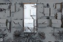 Aerial view of the property and surrounding neighborhood, featuring snow-covered rooftops and bare trees - 3613 113 Avenue, Edmonton, AB  -  