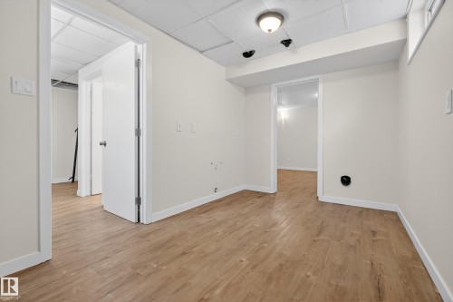 The property features light-colored walls, light-toned flooring, and white trim - 3613 113 Avenue, Edmonton, AB - Indoor Photo Showing Other Room