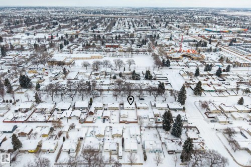 Aerial view of the surrounding neighborhood, featuring residential properties with snow-covered rooftops and streets - 3613 113 Avenue, Edmonton, AB - Outdoor With View