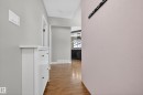 This entryway features light gray walls and hardwood flooring - 3613 113 Avenue, Edmonton, AB  - Indoor Photo Showing Other Room 
