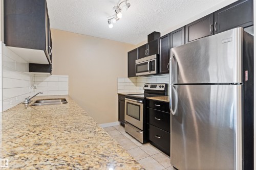 103 12660 142 Avenue, Edmonton, AB - Indoor Photo Showing Kitchen With Stainless Steel Kitchen With Double Sink