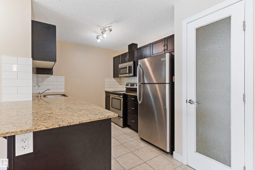 103 12660 142 Avenue, Edmonton, AB - Indoor Photo Showing Kitchen With Stainless Steel Kitchen