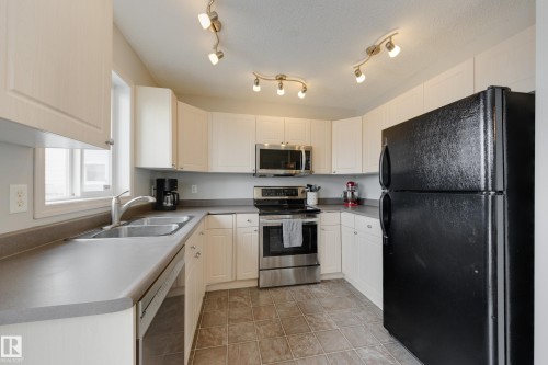 2376 30 Avenue, Edmonton, AB - Indoor Photo Showing Kitchen With Double Sink