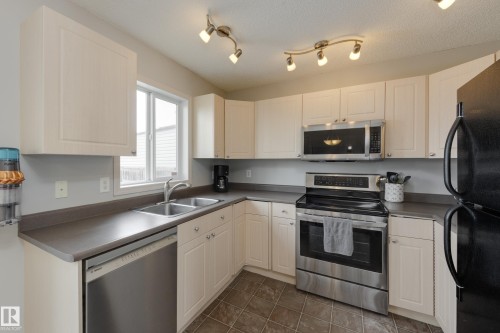 2376 30 Avenue, Edmonton, AB - Indoor Photo Showing Kitchen With Double Sink