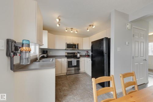 2376 30 Avenue, Edmonton, AB - Indoor Photo Showing Kitchen With Double Sink