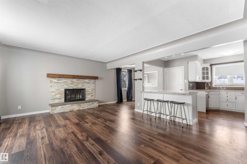 7316 82 Street, Edmonton, AB - Indoor Photo Showing Living Room With Fireplace