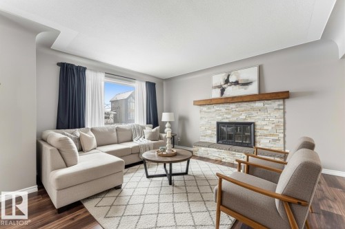 7316 82 Street, Edmonton, AB - Indoor Photo Showing Living Room With Fireplace