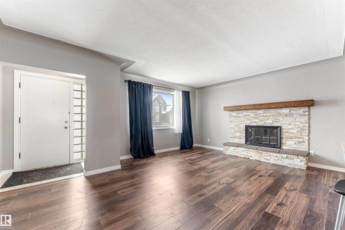 7316 82 Street, Edmonton, AB - Indoor Photo Showing Living Room With Fireplace