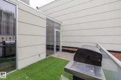 This property features an outdoor patio area with artificial turf flooring - 