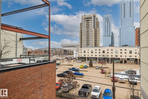 The property features a brick exterior and a balcony with a glass railing - 314 10309 107 Street, Edmonton, AB - Outdoor