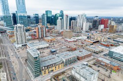 Aerial view showcasing the urban landscape with numerous high-rise buildings and commercial properties - 