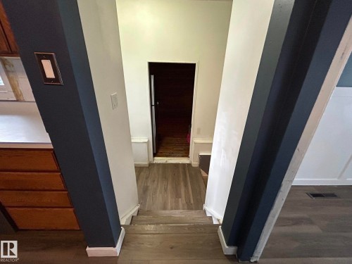 Hall with dark wood finished floors - 15016 80 Street, Edmonton, AB - Indoor Photo Showing Other Room