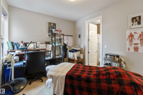 This versatile room features light-colored walls, a window providing natural light, and light-toned flooring - 4 Lakeshore Cove, Beaumont, AB 