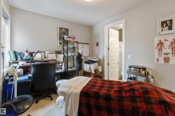 This versatile room features light-colored walls, a window providing natural light, and light-toned flooring - 