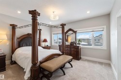 The property features a spacious room with light gray walls and plush carpet flooring - 