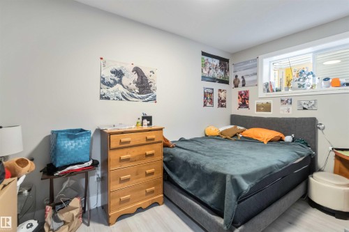 This room features light-colored walls and flooring, with a window providing natural light - 4 Lakeshore Cove, Beaumont, AB 