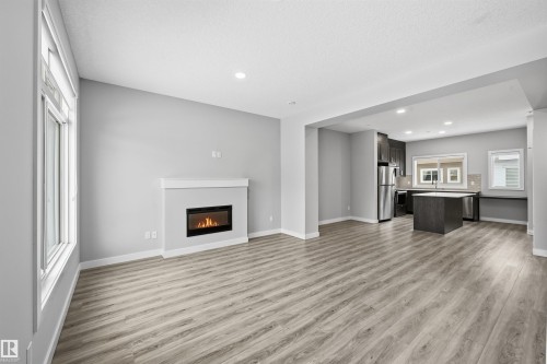 80 1010 Rabbit Hill Road, Edmonton, AB - Indoor Photo Showing Living Room With Fireplace