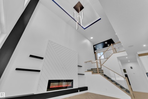 749 Astoria Way, Devon, AB - Indoor Photo Showing Other Room With Fireplace