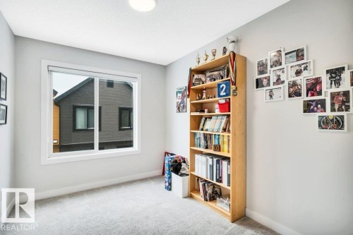 This room features light grey walls and light grey carpet - 99 1010 Rabbit Hill Road, Edmonton, AB - Indoor