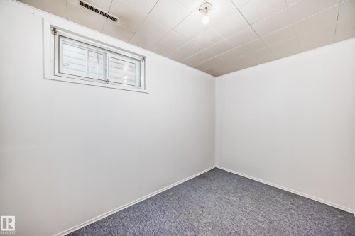 This room features white walls, a single window, and a ceiling light fixture - 4237 116 Avenue, Edmonton, AB - Indoor Photo Showing Other Room