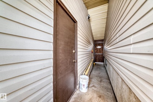 The property features a concrete walkway providing outdoor access - 4237 116 Avenue, Edmonton, AB - Outdoor With Exterior