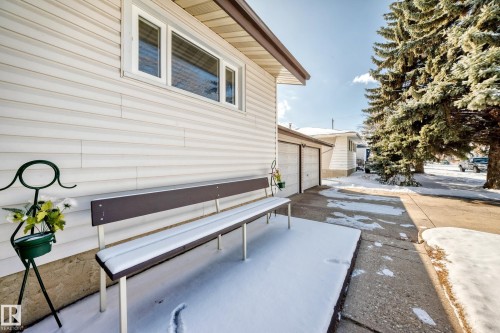 The property features white siding and a brown roofline, with a window visible on the side - 4237 116 Avenue, Edmonton, AB - Outdoor With Exterior