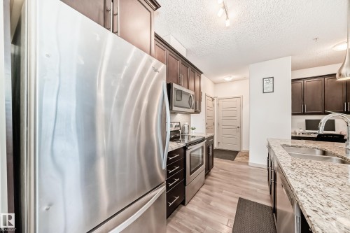 406 504 Griesbach Parade, Edmonton, AB - Indoor Photo Showing Kitchen With Double Sink With Upgraded Kitchen