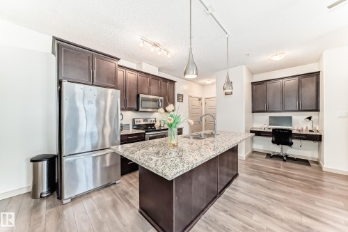 406 504 Griesbach Parade, Edmonton, AB - Indoor Photo Showing Kitchen With Double Sink With Upgraded Kitchen