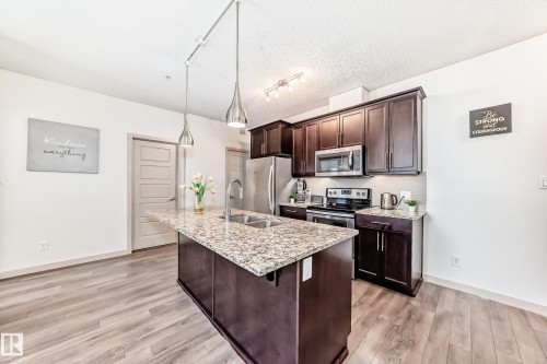 406 504 Griesbach Parade, Edmonton, AB - Indoor Photo Showing Kitchen With Double Sink With Upgraded Kitchen