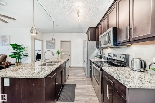 406 504 Griesbach Parade, Edmonton, AB - Indoor Photo Showing Kitchen With Double Sink With Upgraded Kitchen
