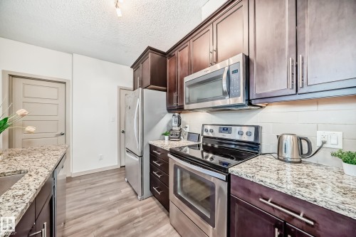 406 504 Griesbach Parade, Edmonton, AB - Indoor Photo Showing Kitchen With Upgraded Kitchen
