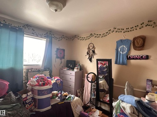 The room features a window providing natural light, light-colored walls, and a ceiling light fixture - 9724 102 Avenue, Westlock, AB - Indoor Photo Showing Other Room