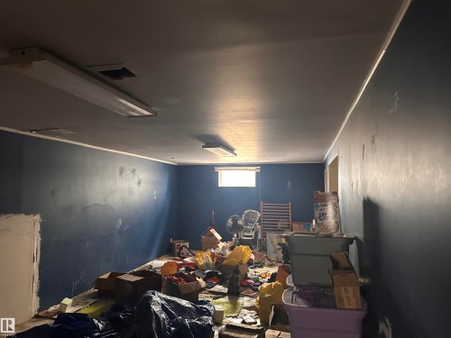 This room features painted walls and a ceiling with overhead lighting fixtures - 9724 102 Avenue, Westlock, AB - Indoor