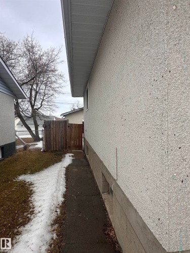 The property features exterior stucco siding and a concrete foundation - 9724 102 Avenue, Westlock, AB - Outdoor