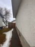 The property features exterior stucco siding and a concrete foundation - 9724 102 Avenue, Westlock, AB  - Outdoor 