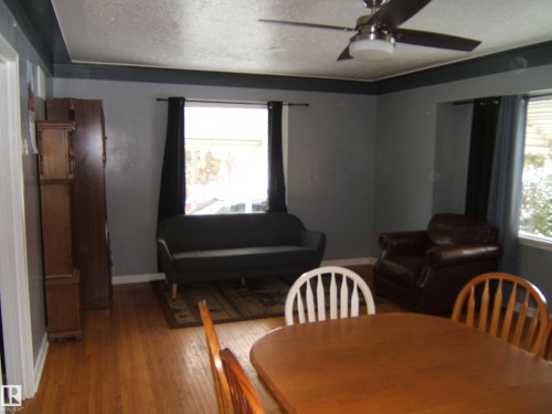 This room features hardwood floors and a ceiling fan - 5023 50 Street, Two Hills, AB - Indoor Photo Showing Dining Room